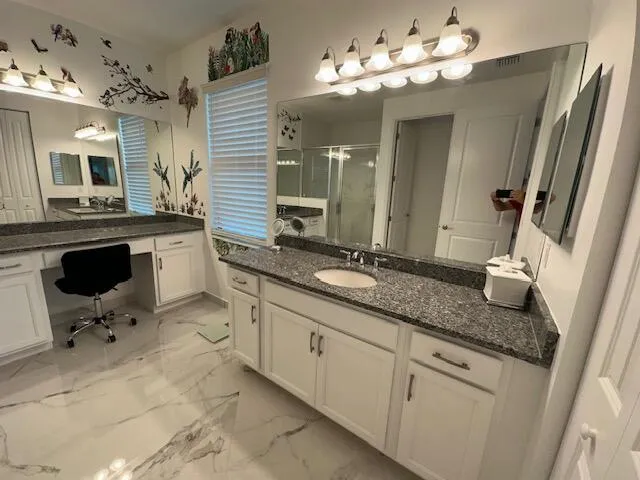 a bathroom with a sink double vanity and a mirror