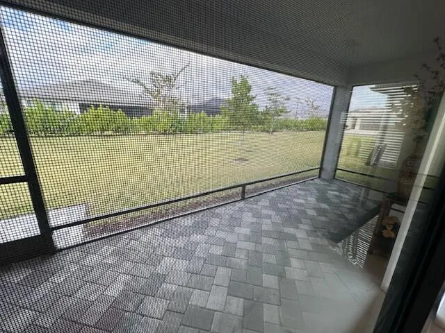 a view of an outdoor space and deck in the back yard