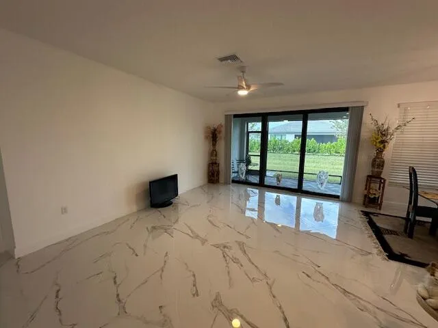 a view of an empty room with a window