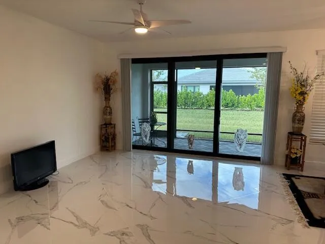 a view of an empty room with a window