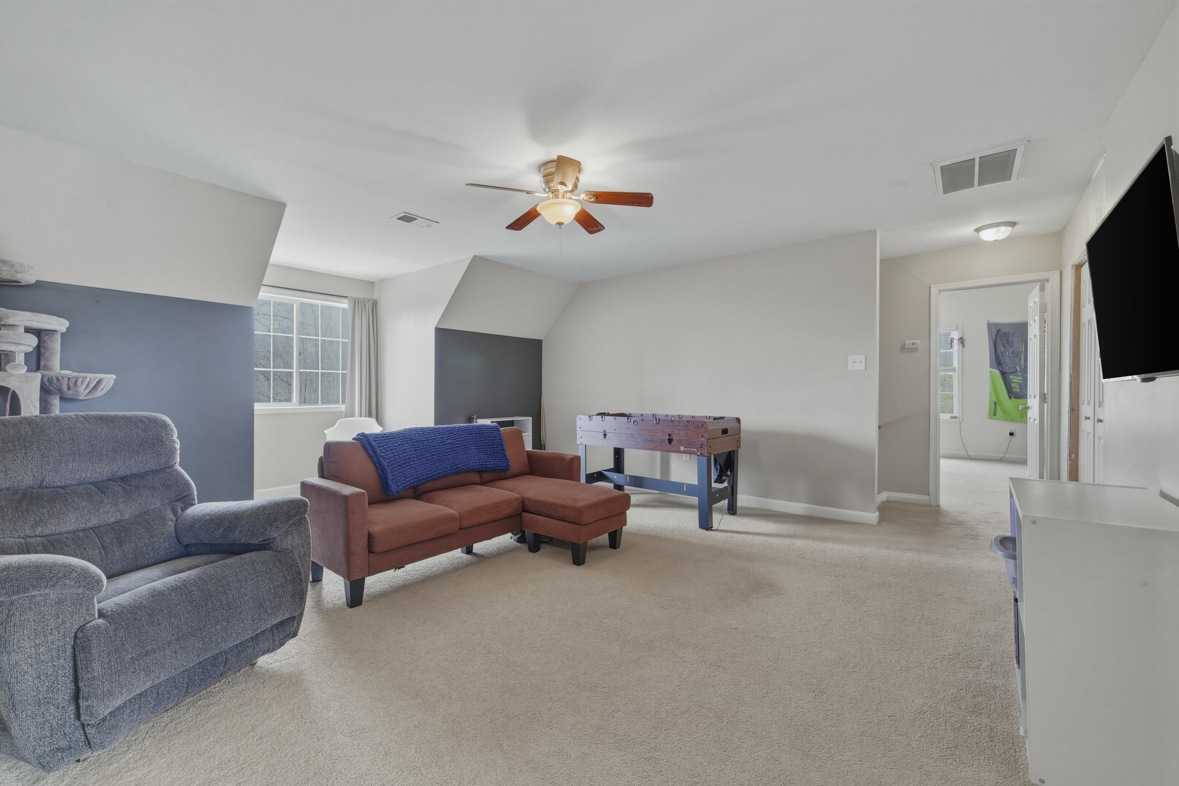 257 Hunter Road Maurertown, VA 22644 - Photo 28 of 61 a living room with furniture and a flat screen tv