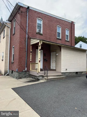 a front view of a house with garage