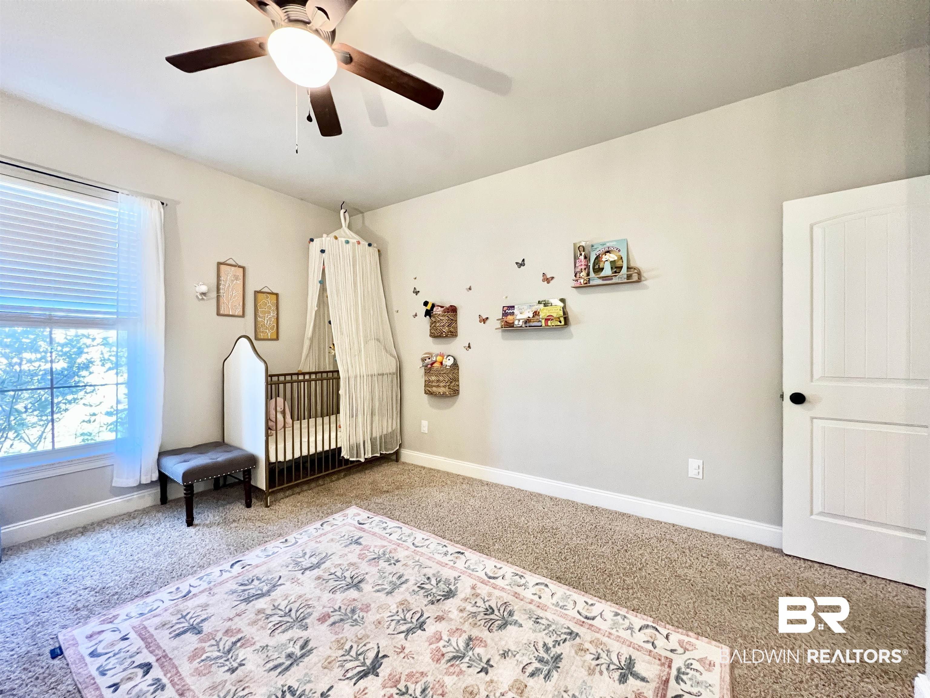 32290 Calder Court Daphne, AL 36527 - Photo 38 of 59 Carpeted bedroom with a crib and ceiling fan