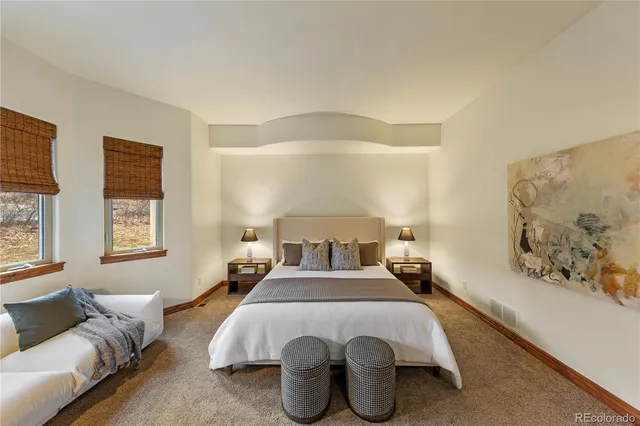 a bedroom with a bed and a couch