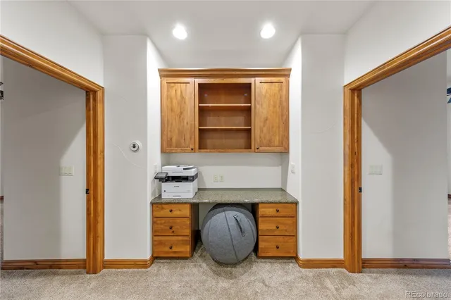 a room with a cabinets and a window