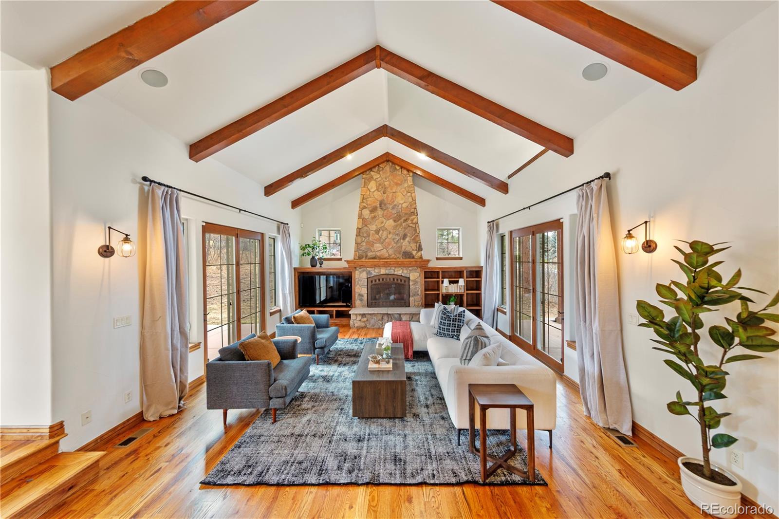 590 Cumberland Road Larkspur, CO 80118 - Photo 4 of 47 a living room with furniture fireplace and flat screen tv