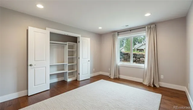 a bathroom with a shower and a glass door