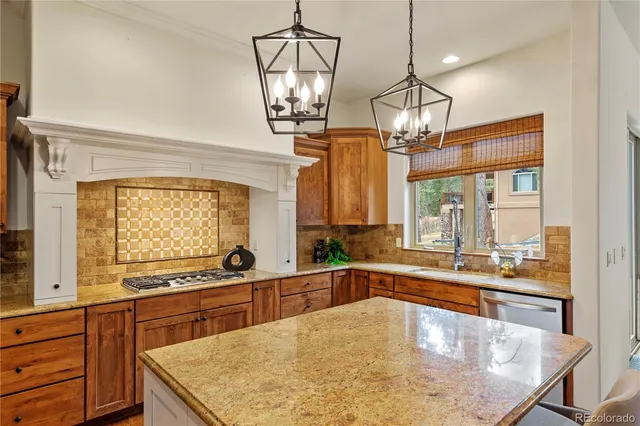 a kitchen with counter top space a sink and cabinets