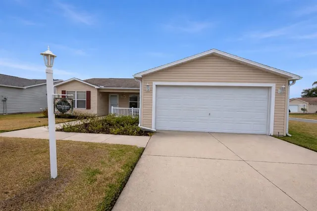 a front view of a house with yard