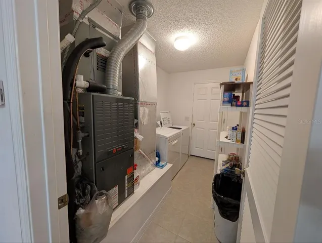 a bathroom with a toilet and a shower curtain