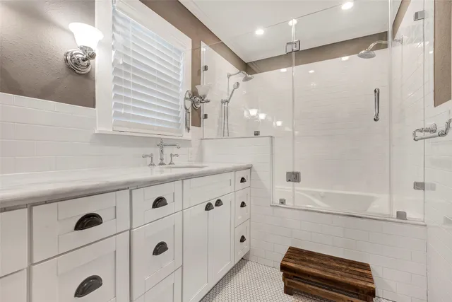 a bathroom with a sink a double vanity and a mirror