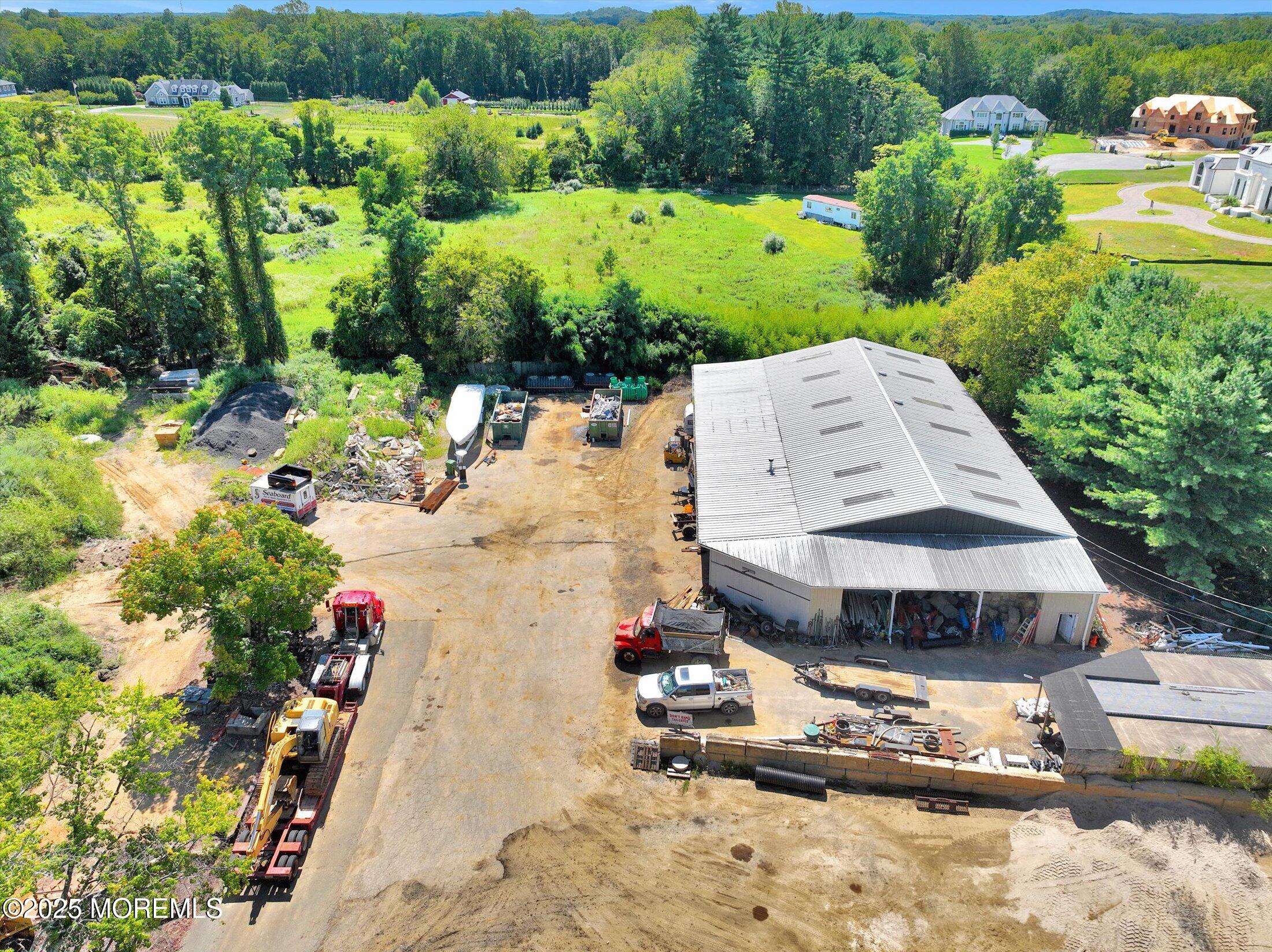86 Stillwell Road Holmdel, NJ 07733 - Photo 3 of 10 a view of a swimming pool with a yard