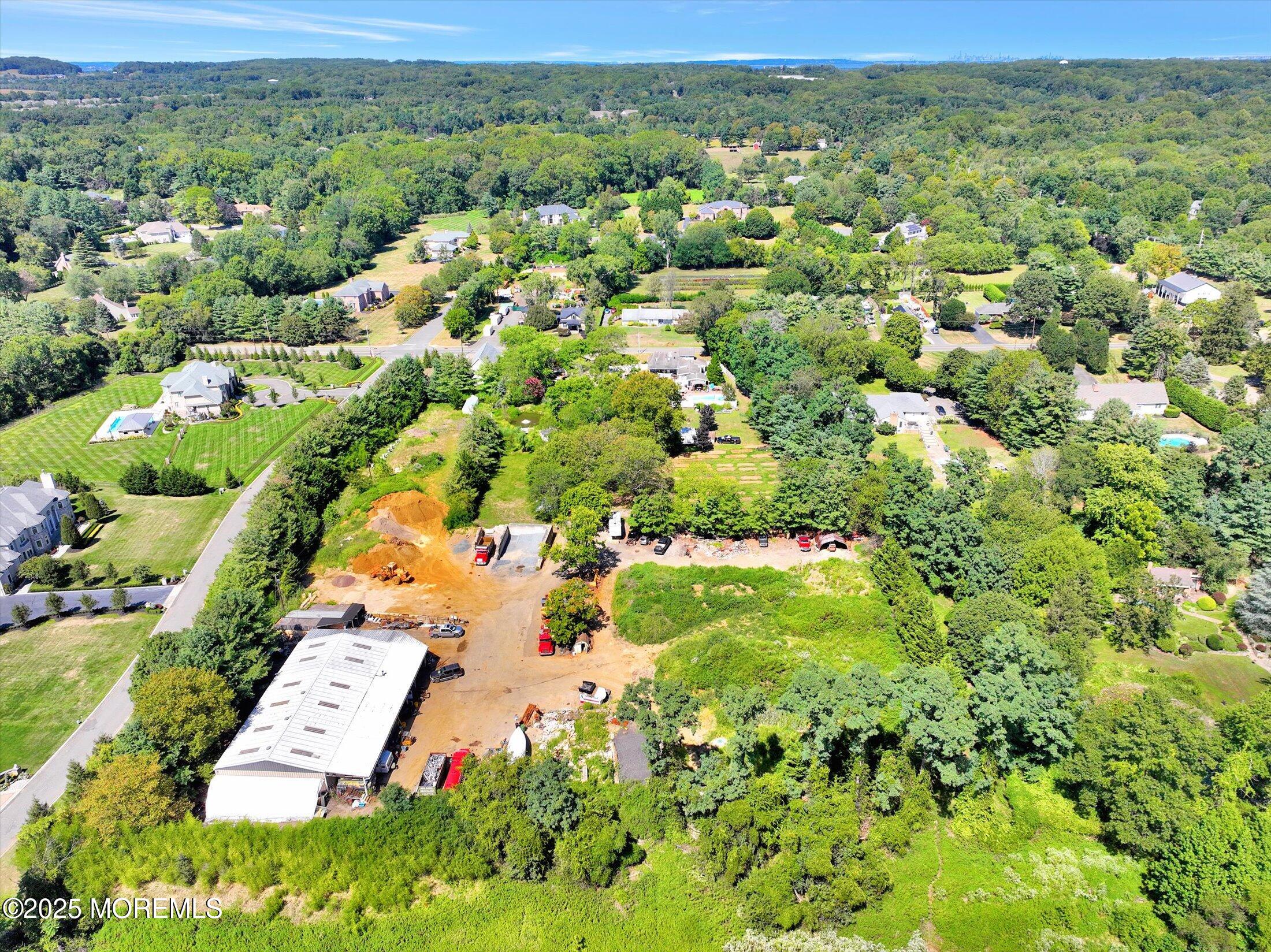 86 Stillwell Road Holmdel, NJ 07733 - Photo 7 of 10 an aerial view of residential houses with outdoor space and trees