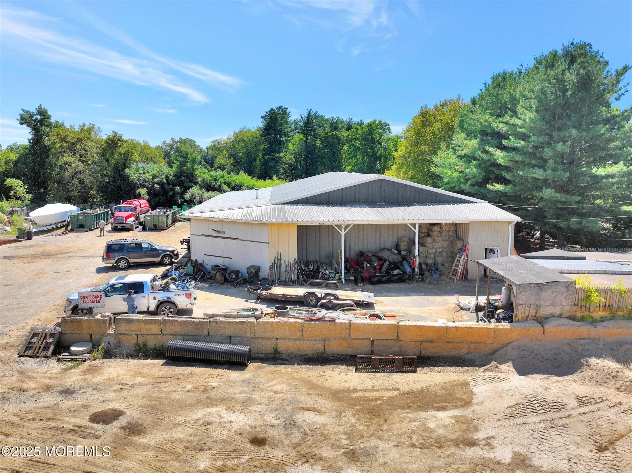86 Stillwell Road Holmdel, NJ 07733 - Photo 8 of 10 a view of a house with swimming pool and sitting area