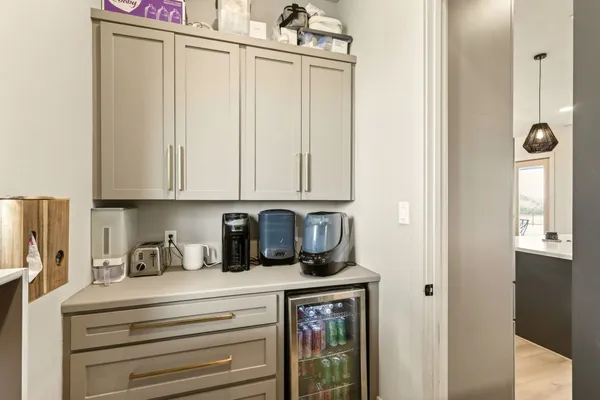 a view of kitchen with stainless steel appliances granite countertop cabinets and a window