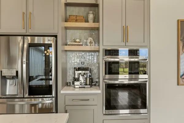 a kitchen with appliances and cabinets