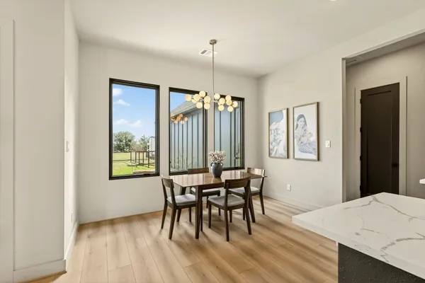 a view of a dining room with furniture window and outside view