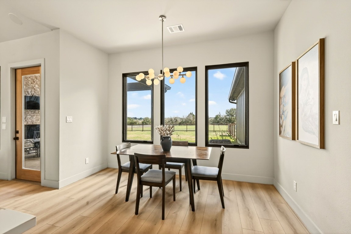 115 Country View Lane Schulenburg, TX 78956 - Photo 22 of 44 a view of a dining room with furniture window and wooden floor