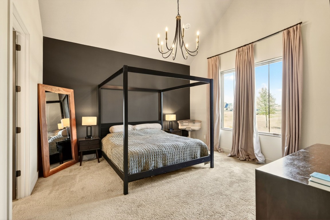 115 Country View Lane Schulenburg, TX 78956 - Photo 25 of 44 a bedroom with a bed and large window