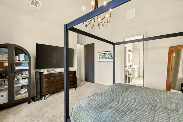 a bedroom with furniture and window
