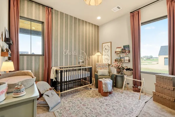a bedroom with furniture and a window