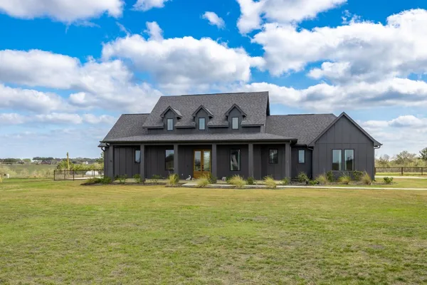 a front view of a house with a ocean view