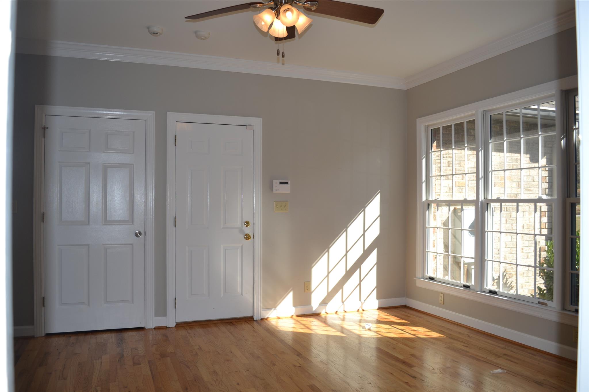 636 Cave Springs Road Lebanon, TN 37087 - Photo 14 of 18 a view of an empty room with wooden floor and a window