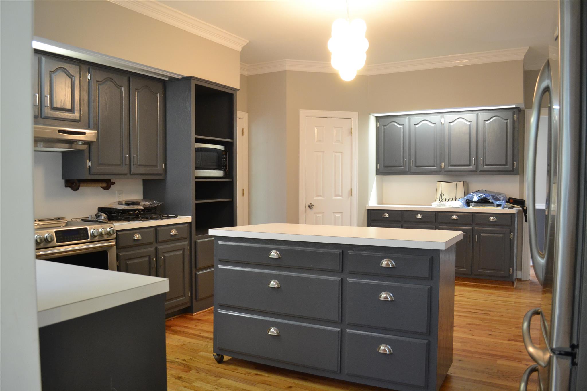 636 Cave Springs Road Lebanon, TN 37087 - Photo 3 of 18 a kitchen with a sink and a stove top oven with wooden floor