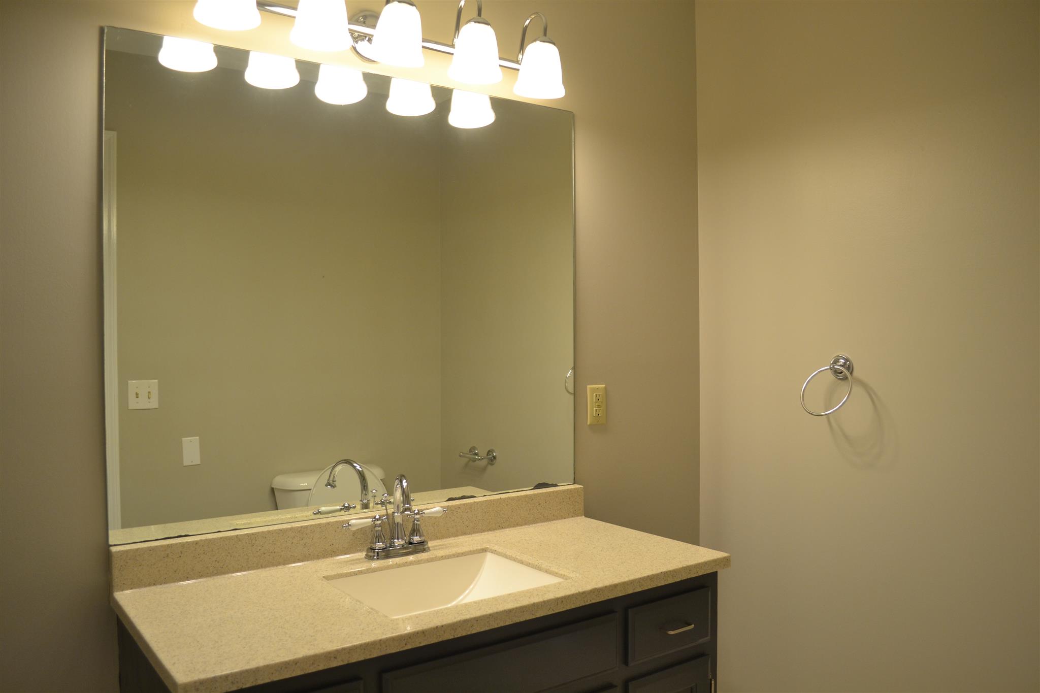 636 Cave Springs Road Lebanon, TN 37087 - Photo 7 of 18 a bathroom with a sink a mirror and a window