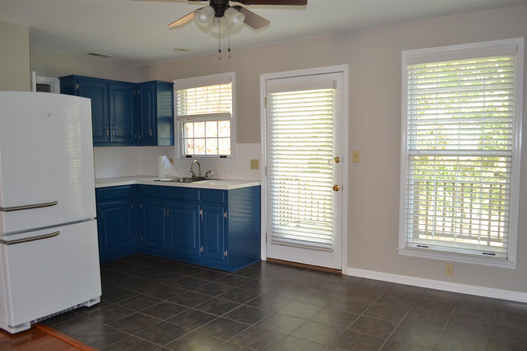 636 Cave Springs Road Lebanon, TN 37087 - Photo 10 of 18 a kitchen with granite countertop a refrigerator and a sink