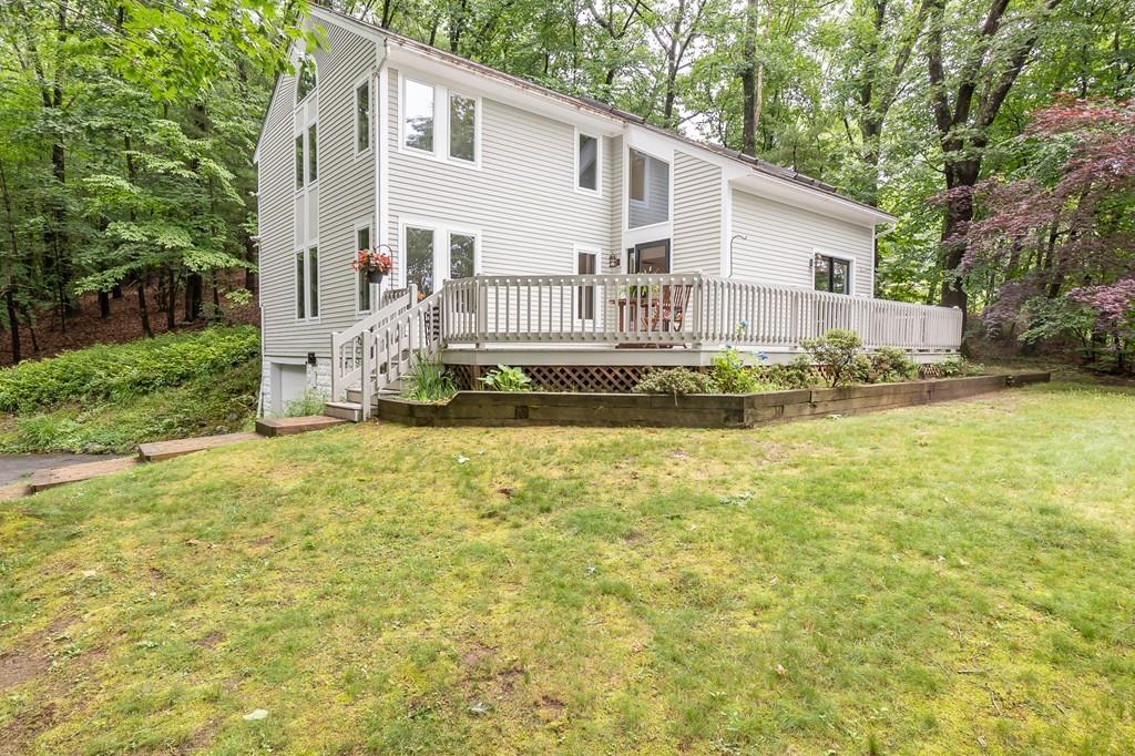 24 River Road Merrimac, MA 01860 - Photo 1 of 32 a view of a white house with a yard