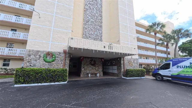 a kitchen with cabinets and window