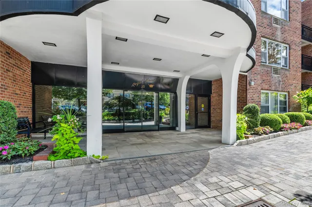 a front view of a building with garden