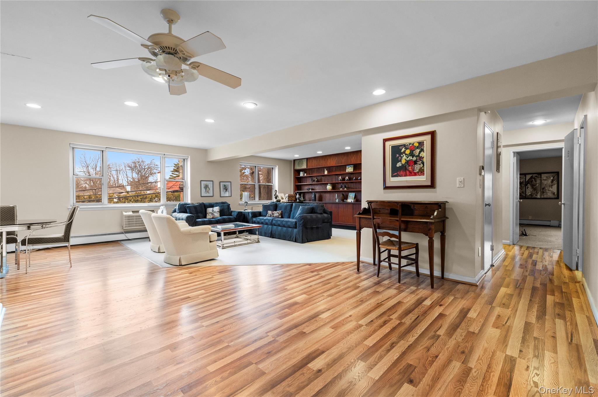 25 Chapel Place, Unit 2L Great Neck, NY 11021 - Photo 5 of 25 a living room with furniture and kitchen view