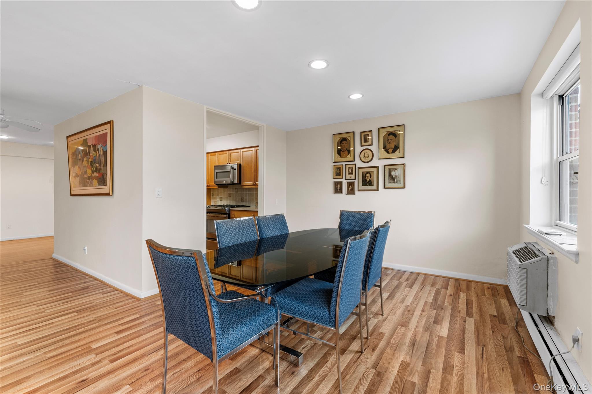 25 Chapel Place, Unit 2L Great Neck, NY 11021 - Photo 9 of 25 a view of a dining room with furniture and wooden floor
