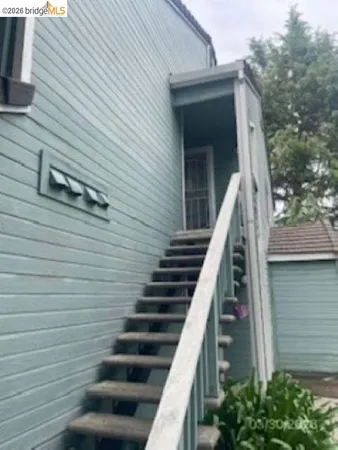 a view of entryway with wooden stairs