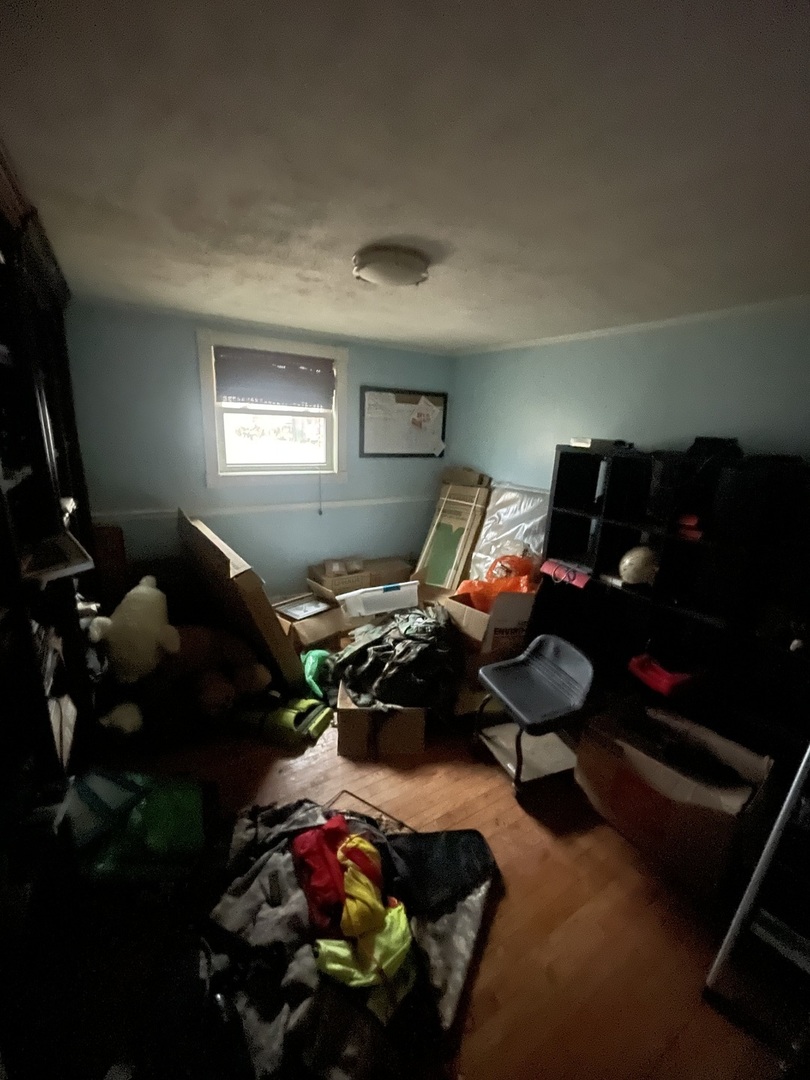 19227 Jacquie Avenue Romeoville, IL 60446 - Photo 11 of 17 a bedroom with furniture and a flat screen tv