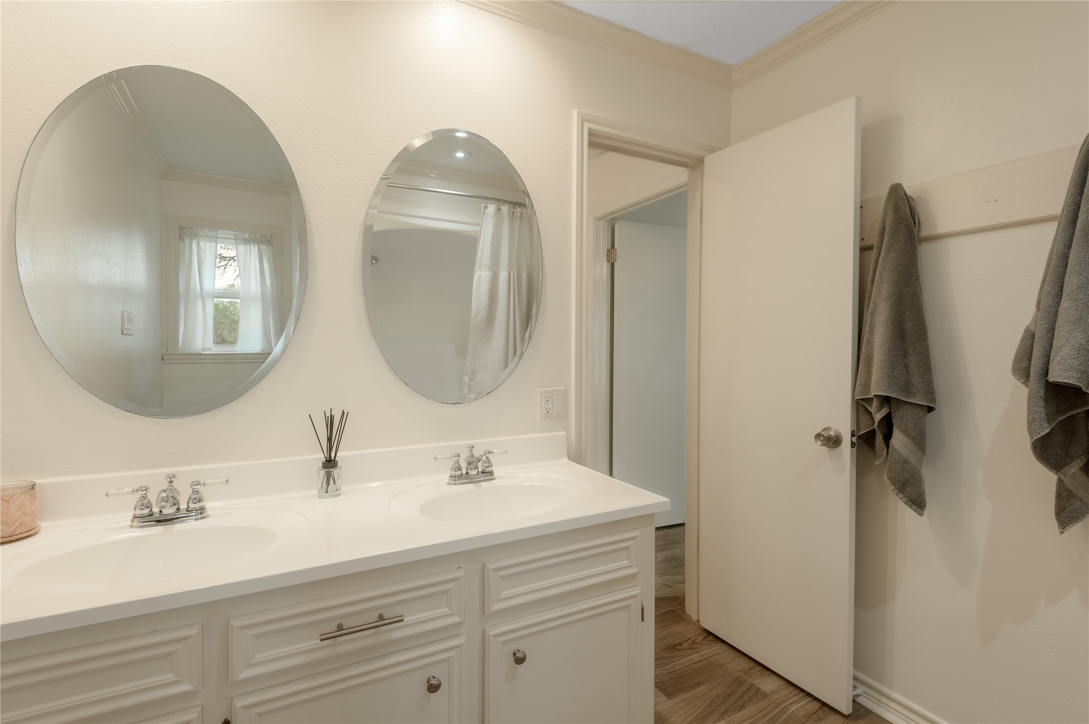758 Wire Road Huntsville, TX 77320 - Photo 13 of 44 a bathroom with double vanity sinks and a mirror