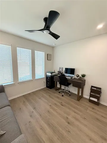 a large room with lots of wooden furniture