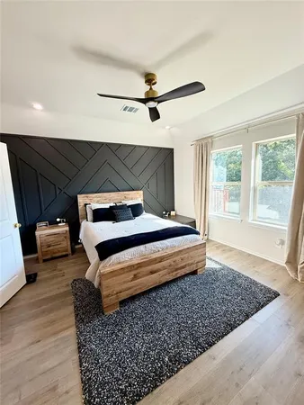 a bedroom with furniture and a window