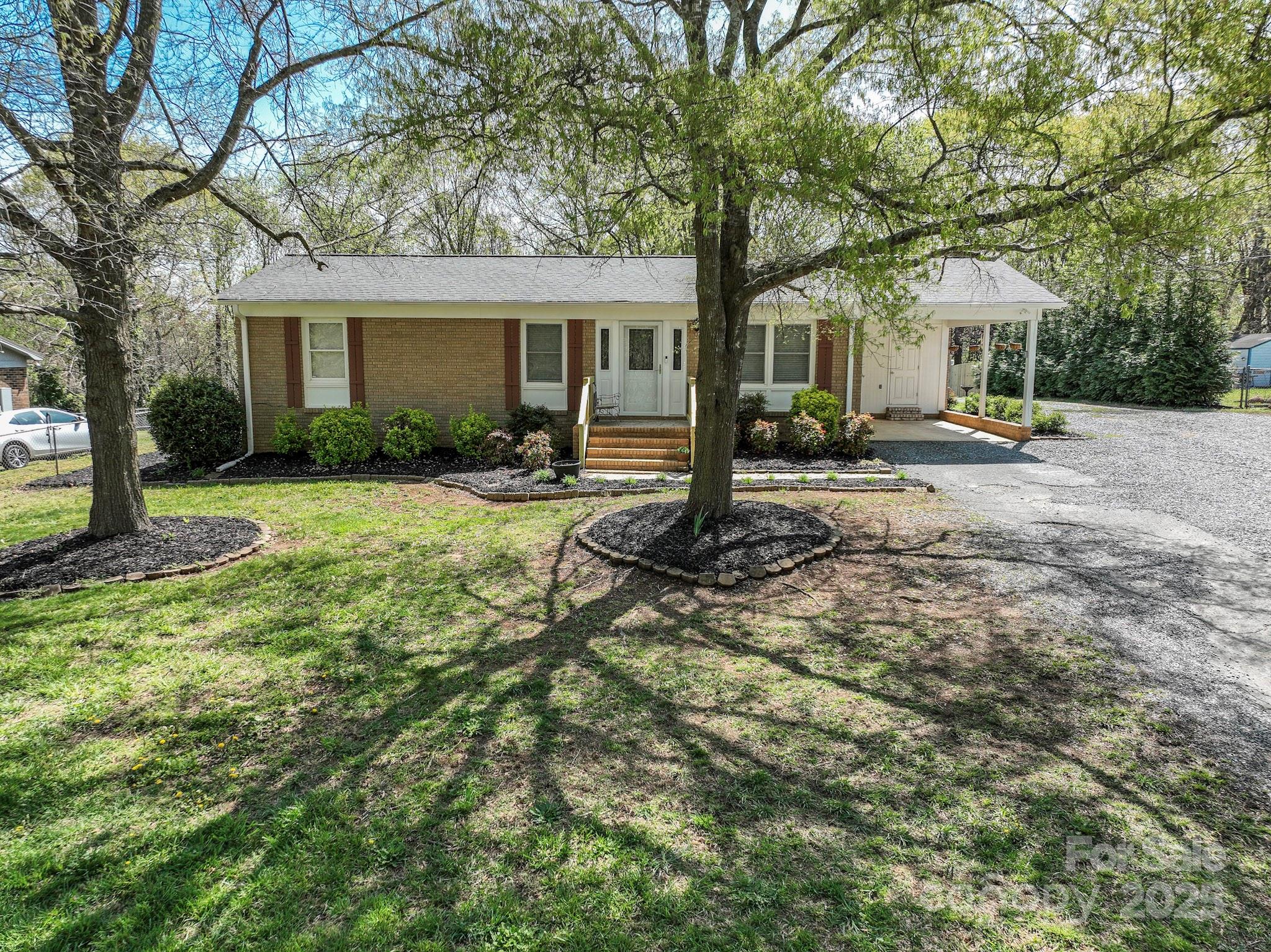 5112 Unionville Road Monroe, NC 28110 - Photo 4 of 31 a front view of a house with yard patio and green space