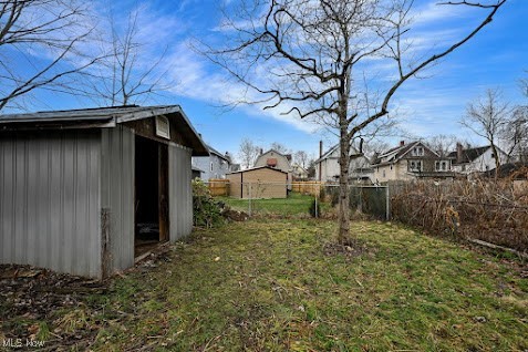667 Elma Street Akron, OH 44310 - Photo 9 of 42 View of yard with a storage shed and a residential view