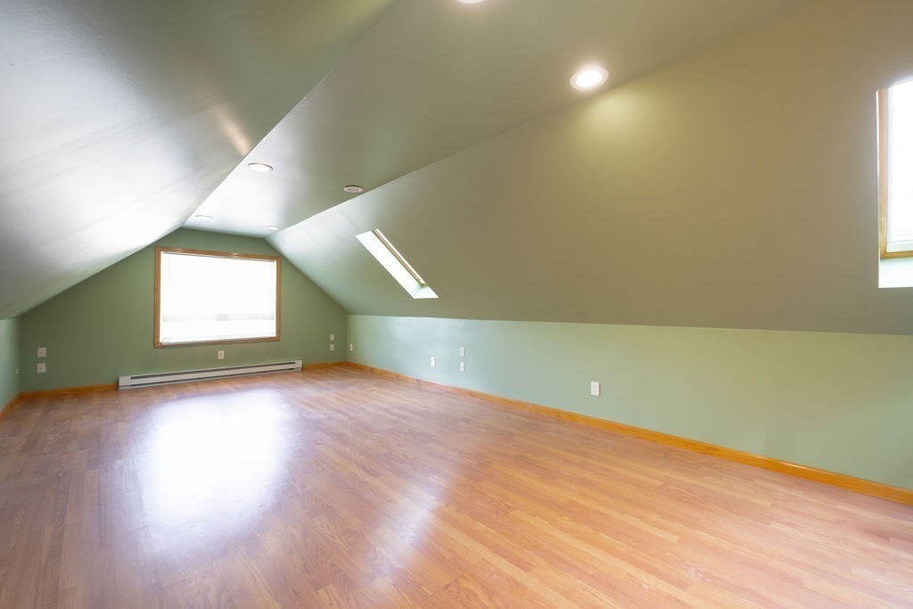 114 Upper Gore Road Webster, MA 01570 - Photo 31 of 40 an empty room with wooden floor and windows