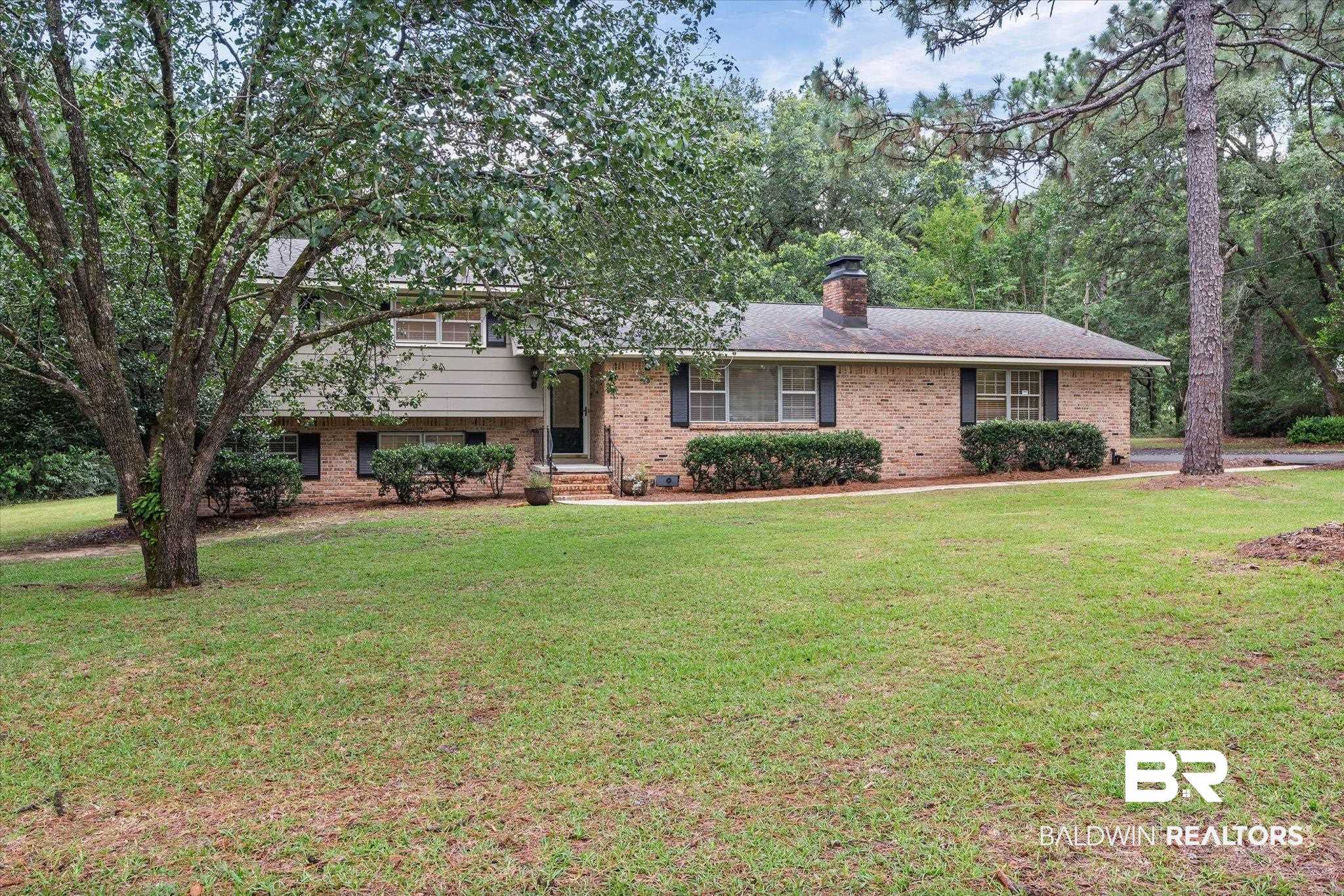 8301 Fordham Road Mobile, AL 36619 - Photo 39 of 57 Expansive front yard with mature trees and a manicured lawn
