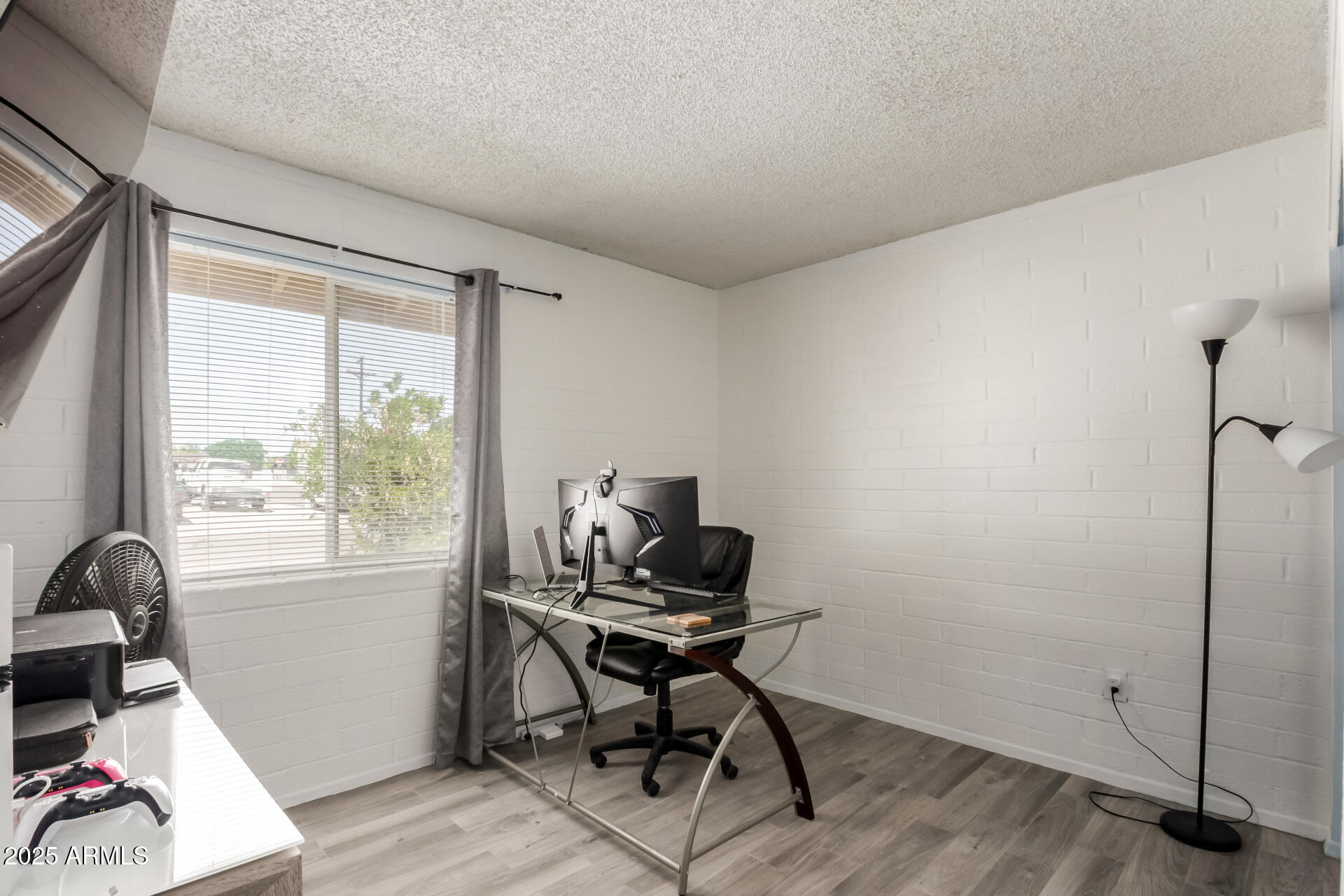433 East Taylor Street Tempe, AZ 85288 - Photo 16 of 32 a view of a workspace with furniture and a window