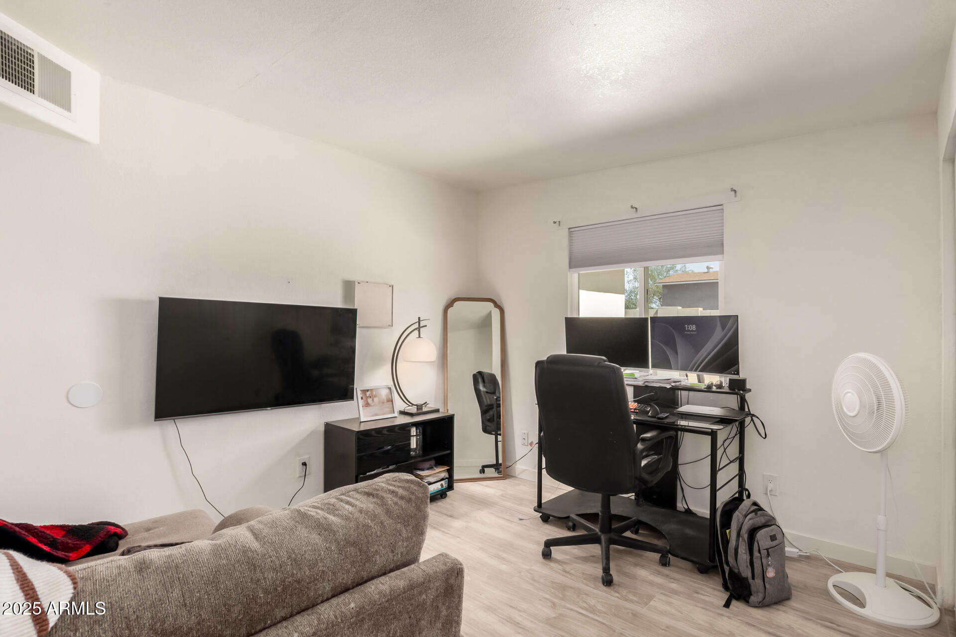 433 East Taylor Street Tempe, AZ 85288 - Photo 20 of 32 a view of a livingroom with furniture and a flat screen tv