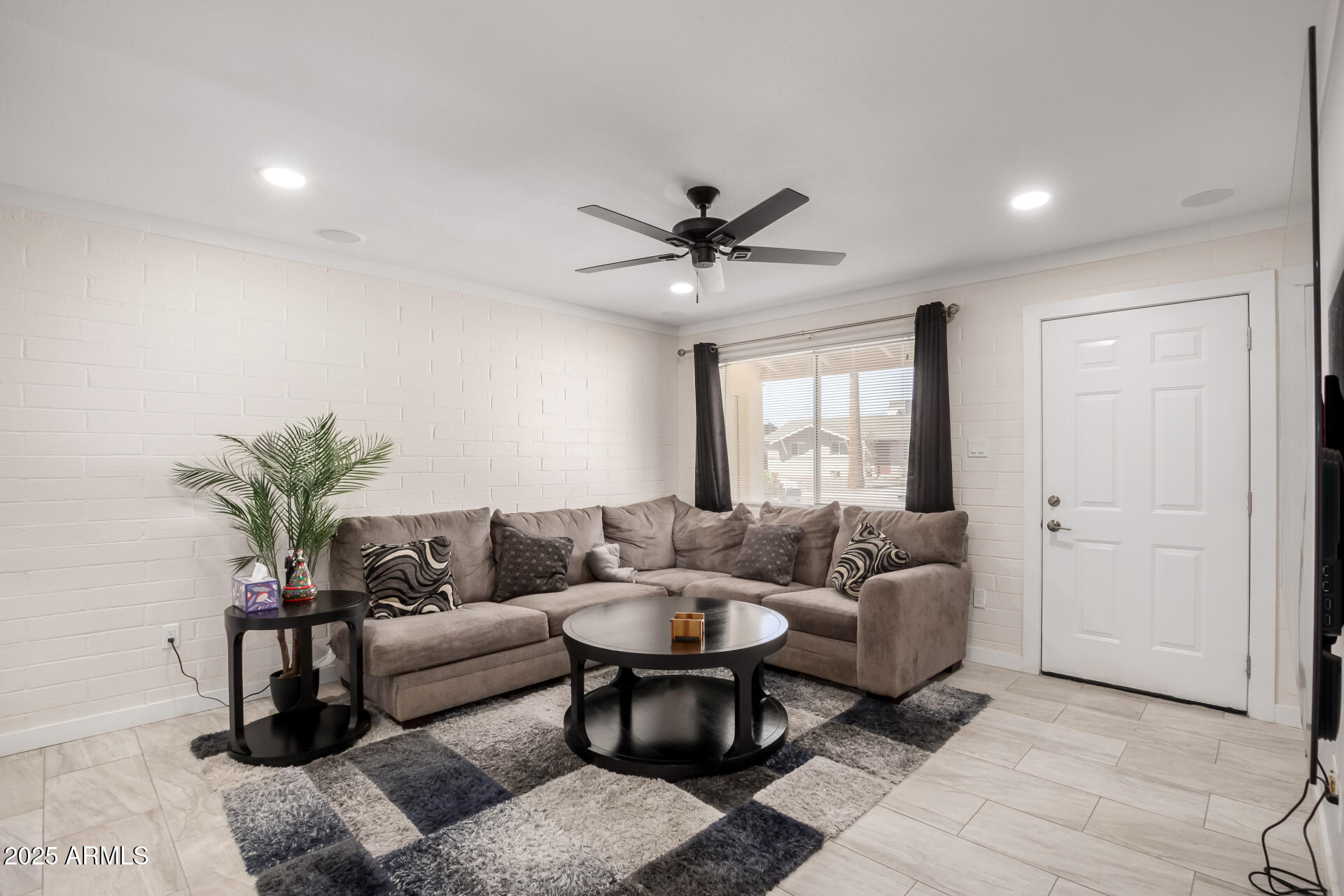 433 East Taylor Street Tempe, AZ 85288 - Photo 2 of 32 a living room with furniture and a large window