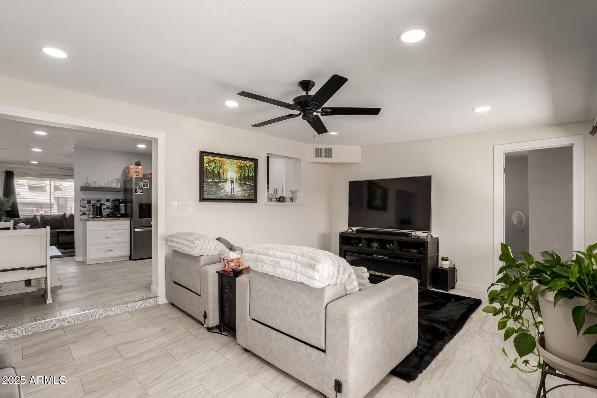 433 East Taylor Street Tempe, AZ 85288 - Photo 7 of 32 a living room with furniture and a flat screen tv
