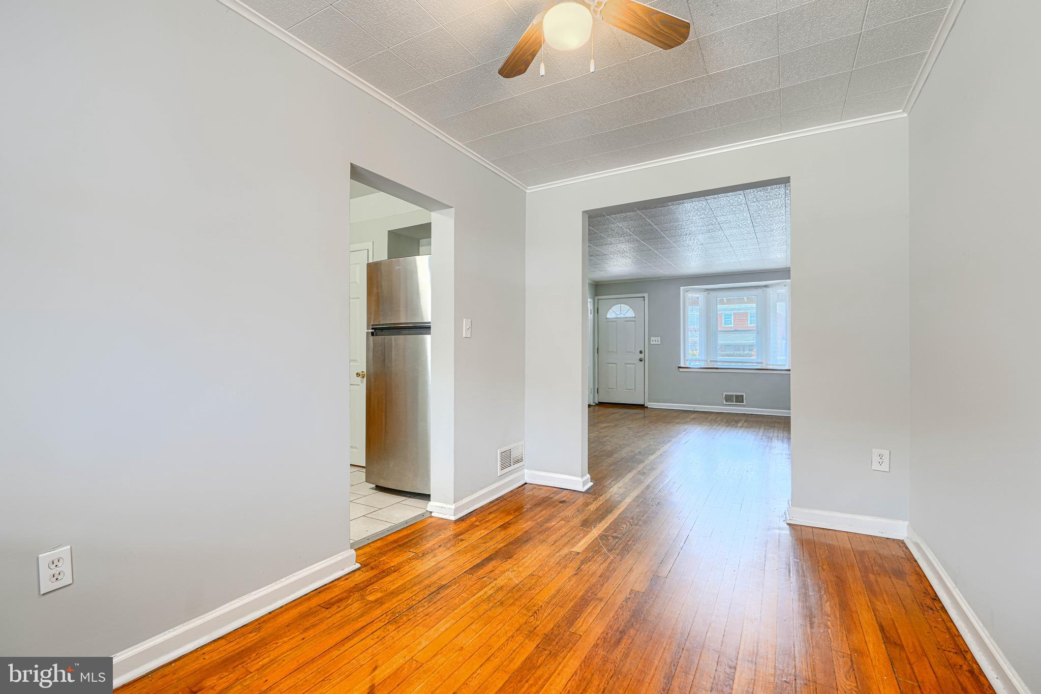 2073 Jasmine Road Baltimore, MD 21222 - Photo 7 of 29 a view of a room with wooden floor and window