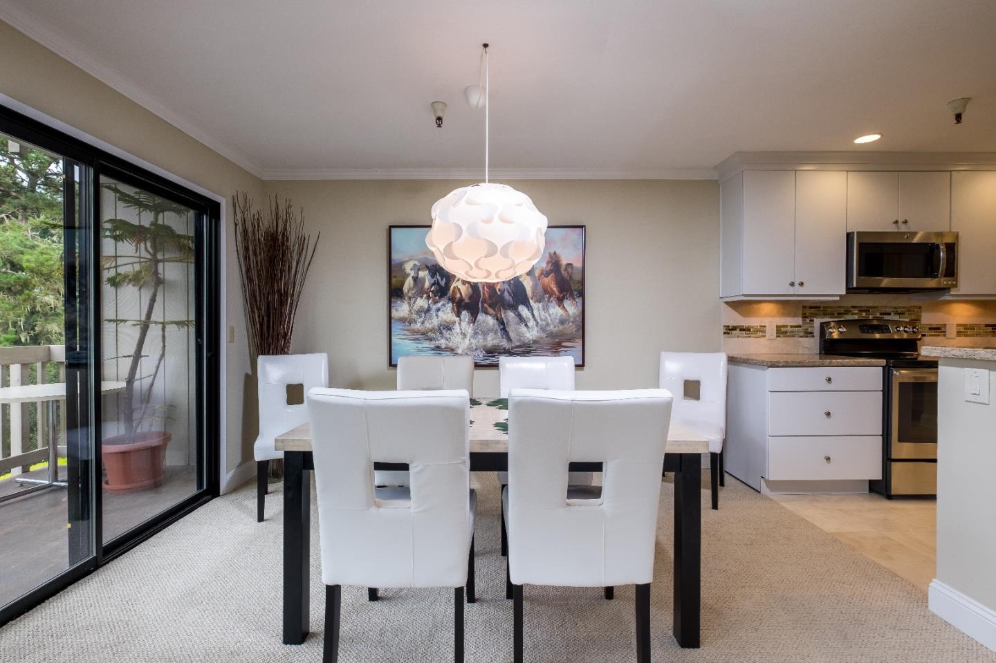 37 Shepherds Knoll Road Monterey, CA 93940 - Photo 7 of 20 a kitchen with a table and chairs in it